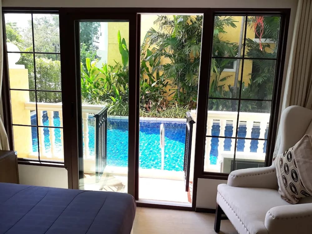 Double Suite with balcony and with pool view full double bed