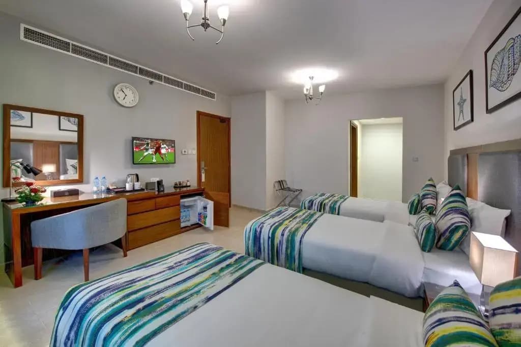 Deluxe Triple room with balcony and with sea view